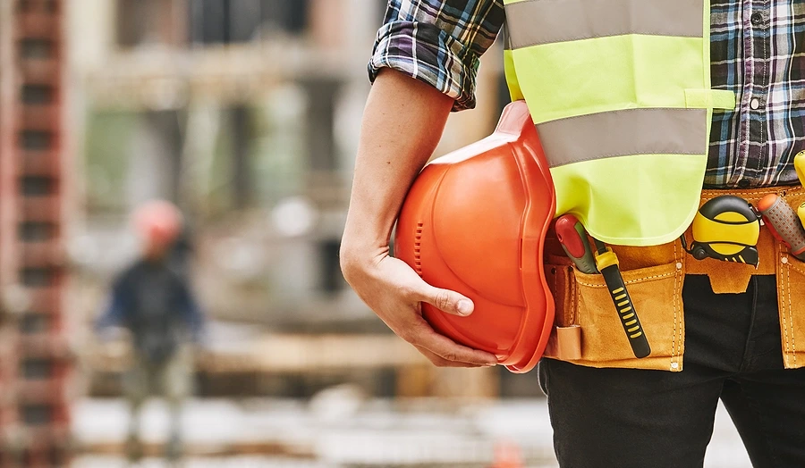 Construction-worker-holding-helmet
